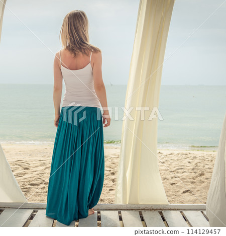 Woman staying at the sea Woman staying at the sea 114129457