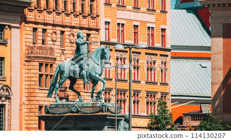 Stockholm, Sweden. Statue Of Former Swedish King Karl XIV Johan Sitting On A Horse Royal Palace. Famous Popular Destination Scenic Place. Close Up Stockholm, Sweden. Statue Of Former Swedish King Karl XIV Johan Sitting On A Horse Royal Palace. Famous Popular Destination Scenic Place. Close Up 114130207