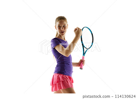 Tennis player. Beautiful girl teenager and athlete with racket in pink-purple sportswear posing against white studio background. 114130624