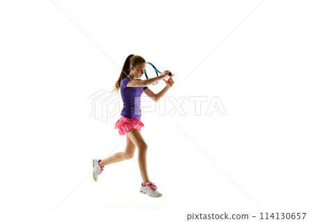 Sporty young girl, tennis player in uniform ready to hit two-handed backhand stroke in motion against white studio background. 114130657