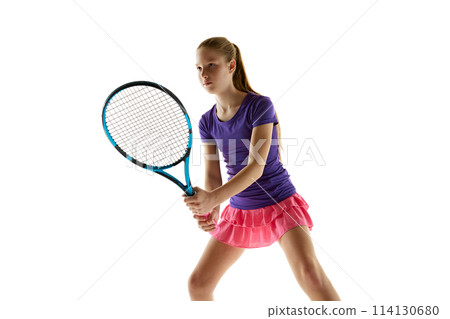 Portrait of young athletic teenage girl in vibrant uniform stand ready to start tennis game against white studio background. Portrait of young athletic teenage girl in vibrant uniform stand ready to start tennis game against white studio background. 114130680