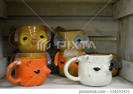 original design of mugs made in a pottery workshop original design of mugs made in a pottery workshop 114131431