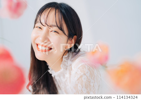 A woman surrounded by flowers A woman surrounded by flowers 114134324