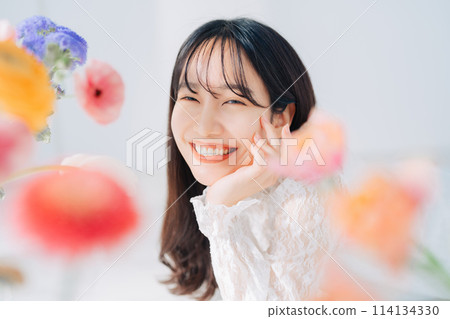 A woman surrounded by flowers 114134330
