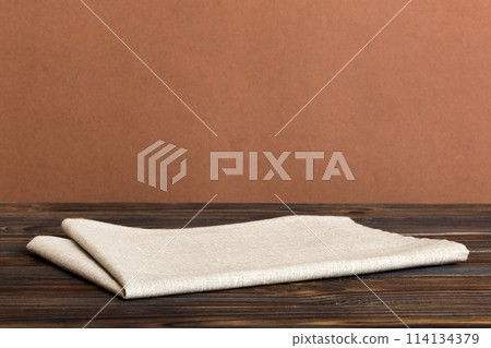 top view with gray kitchen napkin isolated on table background. Folded cloth for mockup with copy space, Flat lay. Minimal style 114134379