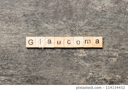 GLAUCOMA word written on wood block. GLAUCOMA text on cement table for your desing, concept GLAUCOMA word written on wood block. GLAUCOMA text on cement table for your desing, concept 114134432