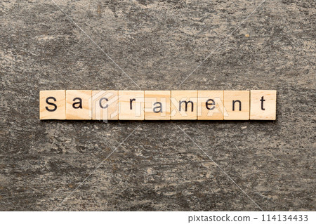 sacrament word written on wood block. sacrament text on table, concept sacrament word written on wood block. sacrament text on table, concept 114134433