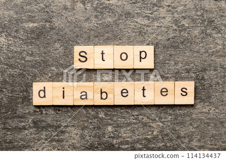 Stop diabetes word written on wood block. Stop diabetes text on cement table for your desing, Top view concept Stop diabetes word written on wood block. Stop diabetes text on cement table for your desing, Top view concept 114134437