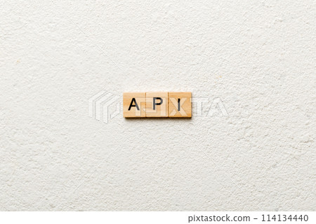 API word written on wood block. application program interface text on table, concept 114134440
