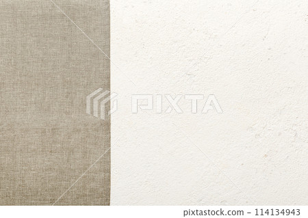 top view with gray kitchen napkin isolated on table background. Folded cloth for mockup with copy space, Flat lay. Minimal style top view with gray kitchen napkin isolated on table background. Folded cloth for mockup with copy space, Flat lay. Minimal style 114134943