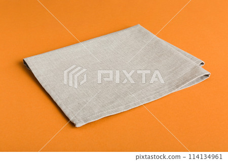 top view with gray kitchen napkin isolated on table background. Folded cloth for mockup with copy space, Flat lay. Minimal style top view with gray kitchen napkin isolated on table background. Folded cloth for mockup with copy space, Flat lay. Minimal style 114134961