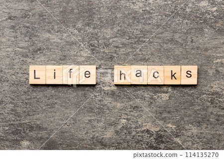 life hacks word written on wood block. life hacks text on table, concept 114135270