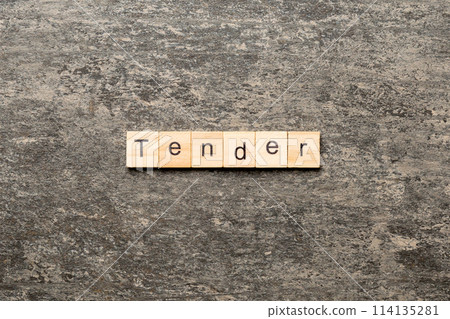 tender word written on wood block. tender text on table, concept tender word written on wood block. tender text on table, concept 114135281