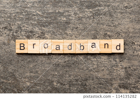 BROADBAND word written on wood block. BROADBAND text on table for your desing, concept BROADBAND word written on wood block. BROADBAND text on table for your desing, concept 114135282