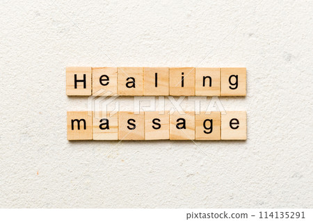 healing massage word written on wood block. healing massage text on cement table for your desing, concept 114135291