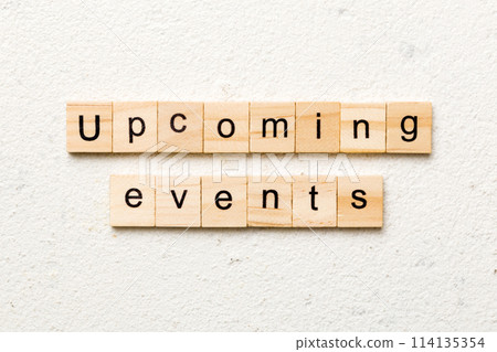 upcoming evente word written on wood block. upcoming evente text on table, concept 114135354