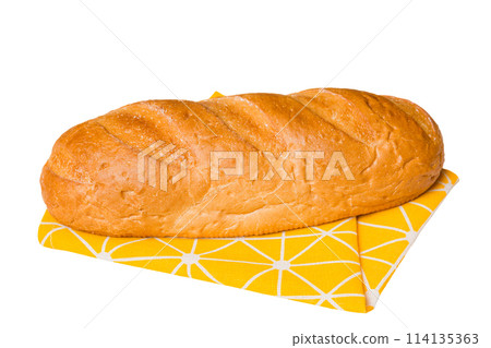 Freshly baked delicious french bread with napkin isolated on white background top view. Healthy white bread loaf Freshly baked delicious french bread with napkin isolated on white background top view. Healthy white bread loaf 114135363