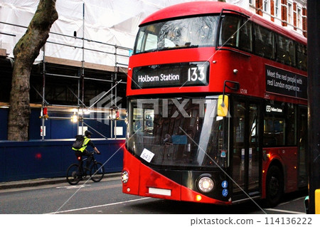 A bus stopped at a traffic light in London, England 114136222