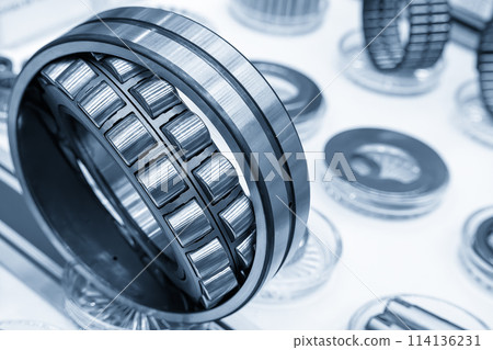 Close up scene the roller bearing parts in the light blue scene. Close up scene the roller bearing parts in the light blue scene. 114136231