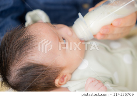Baby drinking milk Baby drinking milk 114136709
