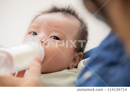 Baby drinking milk Baby drinking milk 114136714