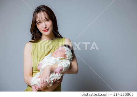 Mother holding a baby Mother holding a baby 114136865