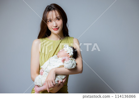 Mother holding a baby 114136866