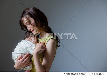 Mother holding a baby Mother holding a baby 114136872