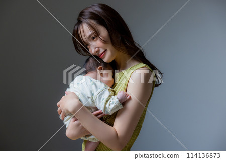 Mother holding a baby Mother holding a baby 114136873