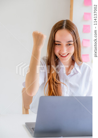 Yes! Caucasian happy businesswoman bookkeeper excited triumphing with raised hands achieve target at home office, Use laptop analysis the graph and Setting challenging business goals Yes! Caucasian happy businesswoman bookkeeper excited triumphing with raised hands achieve target at home office, Use laptop analysis the graph and Setting challenging business goals 114137002