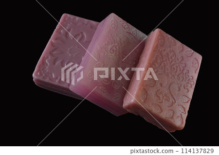 Homemade soap is square in shape with a pattern on the surface. 114137829