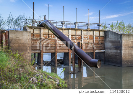 gates and pump station on a channel in a valley of Missouri river near Peru, Nebraska gates and pump station on a channel in a valley of Missouri river near Peru, Nebraska 114138012
