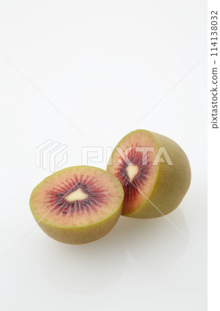 Kiwi Ruby Red is a half-cut cross section in vertical position Kiwi Ruby Red is a half-cut cross section in vertical position 114138032