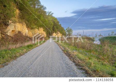 Steamboat Trace, bike trail converted from an abandoned railroad, near Peru, Nebraska, springtime morning scenery 114138058