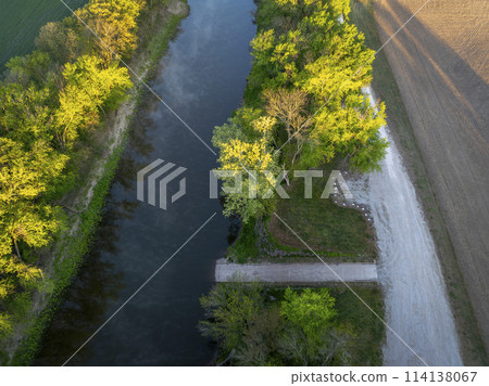 sunrise over boat ramp and the Lamine River at Roberts Bluff access in Missouri, springtime aerial view 114138067