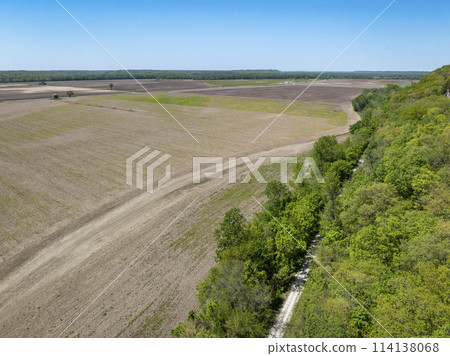 KATY biking trail running along the edge of a wide valley of the Missouri Rive, near WIlton, MO, springtime aerial view KATY biking trail running along the edge of a wide valley of the Missouri Rive, near WIlton, MO, springtime aerial view 114138068