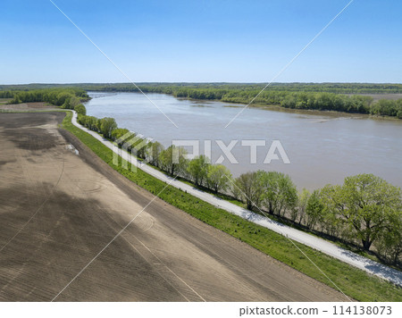 dusty rural road along the Missouri River near WIlton, MO, springtime aerial view dusty rural road along the Missouri River near WIlton, MO, springtime aerial view 114138073