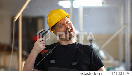Idiot worker using electric drill portrait Idiot worker using electric drill portrait 114138199