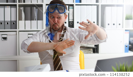 Man wearing suit and tie in goggles and snorkel Man wearing suit and tie in goggles and snorkel 114138252