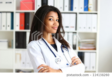 Beautiful black smiling female doctor portrait 114138260