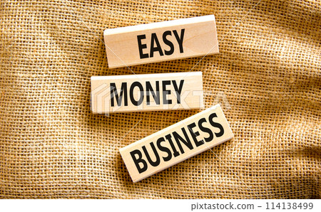 Easy money business symbol. Concept words Easy money business on beautiful wooden blocks. Beautiful canvas table canvas background. Easy money business concept. Copy space. 114138499
