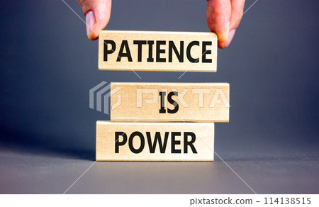 Patience is power symbol. Concept words Patience is power on beautiful wooden blocks. Beautiful grey table grey background. Businessman hand. Business and patience is power concept. Copy space. 114138515