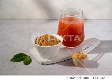 Protein collagen pink powder, fruits and vegetables powder, food supplement in a glass with water Protein collagen pink powder, fruits and vegetables powder, food supplement in a glass with water 114138592