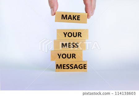 Business concept growth success process. Wood blocks on white background, copy space. Businessman hand. Words 'make your mess your message'. Conceptual image of motivation. 114138603