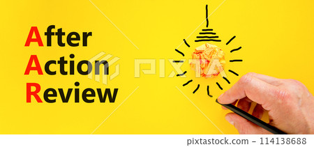AAR After action review symbol. Concept words AAR After action review on beautiful yellow paper. Beautiful yellow background. Businessman hand. Business AAR after action review concept. Copy space. AAR After action review symbol. Concept words AAR After action review on beautiful yellow paper. Beautiful yellow background. Businessman hand. Business AAR after action review concept. Copy space. 114138688