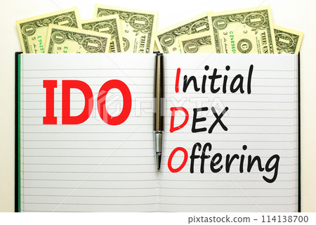 IDO initial DEX offering symbol. Concept words IDO initial DEX offering on beautiful white note. Dollar bills. Beautiful dollar bills background. Business IDO initial DEX offering concept. Copy space. IDO initial DEX offering symbol. Concept words IDO initial DEX offering on beautiful white note. Dollar bills. Beautiful dollar bills background. Business IDO initial DEX offering concept. Copy space. 114138700