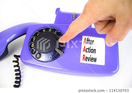 AAR After action review symbol. Concept words AAR After action review on beautiful old disk phone. Beautiful white background. Businessman hand. Business AAR after action review concept. Copy space. AAR After action review symbol. Concept words AAR After action review on beautiful old disk phone. Beautiful white background. Businessman hand. Business AAR after action review concept. Copy space. 114138703