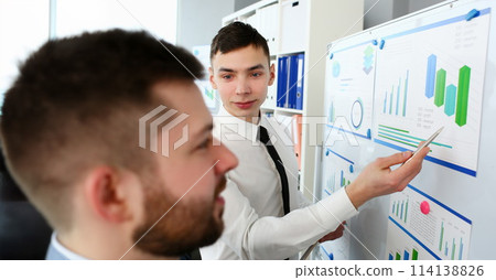 Young handsome teacher man in suit with Young handsome teacher man in suit with 114138826