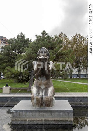 Novorossiysk, Russia - 08.18.2023. Sculpture Giving water and a house with a turret, Black Sea, port, Krasnodar Territory, Novorossiysk Novorossiysk, Russia - 08.18.2023. Sculpture Giving water and a house with a turret, Black Sea, port, Krasnodar Territory, Novorossiysk 114140269