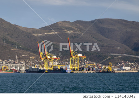 Novorossiysk, Russia 08.18.2023. Port cranes, Black Sea, port, Krasnodar Territory, Novorossiys Novorossiysk, Russia 08.18.2023. Port cranes, Black Sea, port, Krasnodar Territory, Novorossiys 114140342